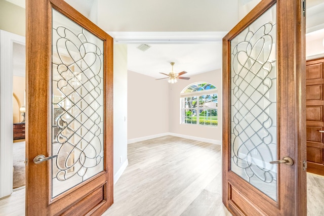 entrance foyer featuring french doors, light hardwood / wood-style flooring, and ceiling fan