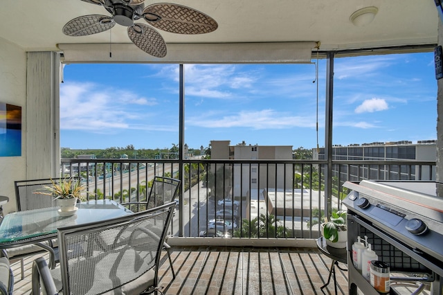 sunroom / solarium with ceiling fan and plenty of natural light