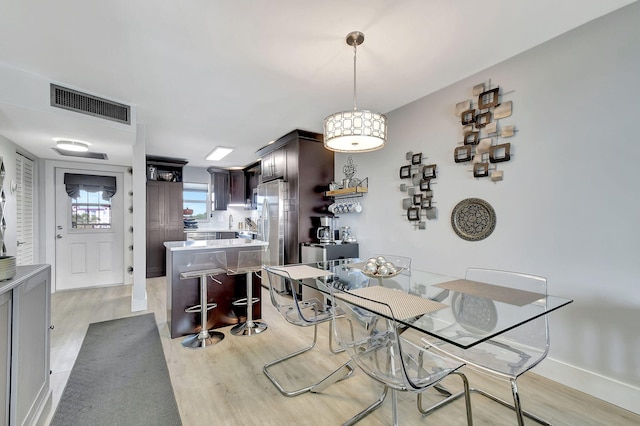 dining area featuring light hardwood / wood-style flooring