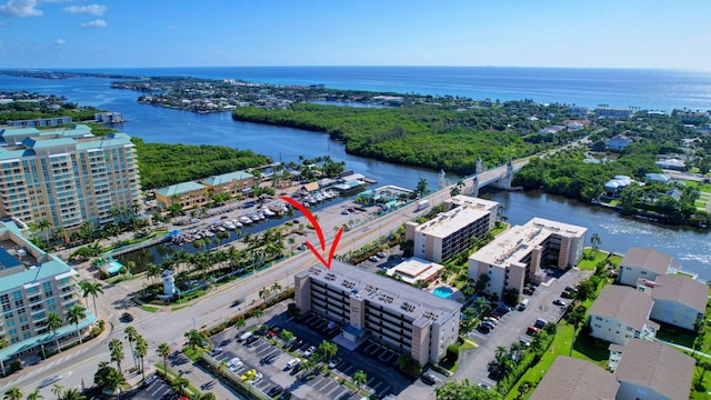 birds eye view of property featuring a water view