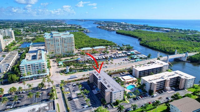 birds eye view of property with a water view