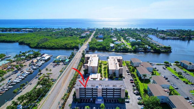 birds eye view of property featuring a water view