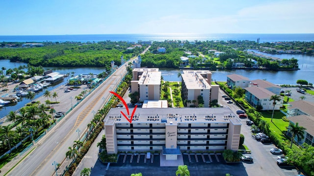 birds eye view of property with a water view