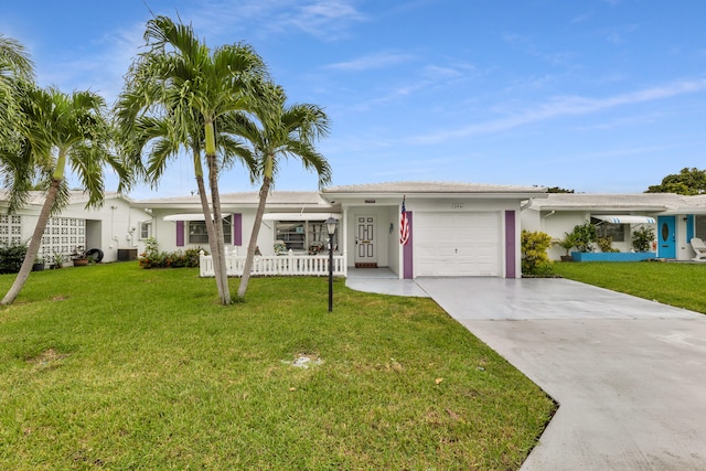 single story home with a front yard and a garage