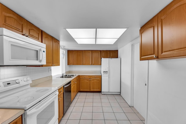 kitchen with white appliances, light tile patterned floors, tasteful backsplash, and sink