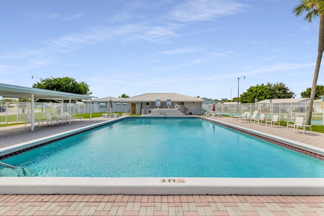 view of swimming pool featuring a patio