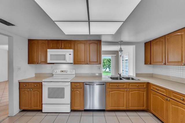 kitchen with dishwasher, electric stove, tasteful backsplash, and sink