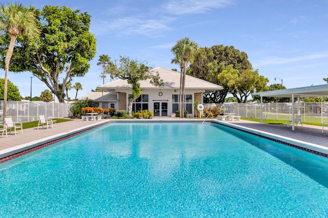 view of swimming pool with a patio