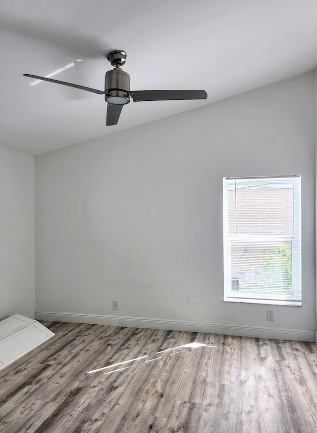 empty room featuring ceiling fan and light hardwood / wood-style flooring