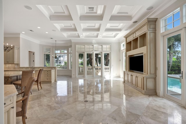 living area with a wealth of natural light, ornamental molding, marble finish floor, and coffered ceiling