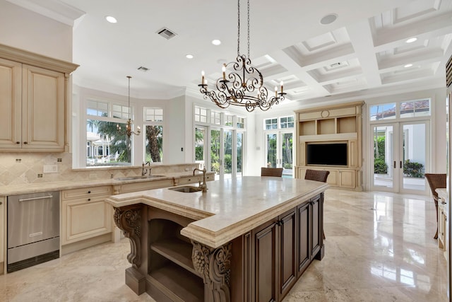 kitchen with a sink, a chandelier, and french doors