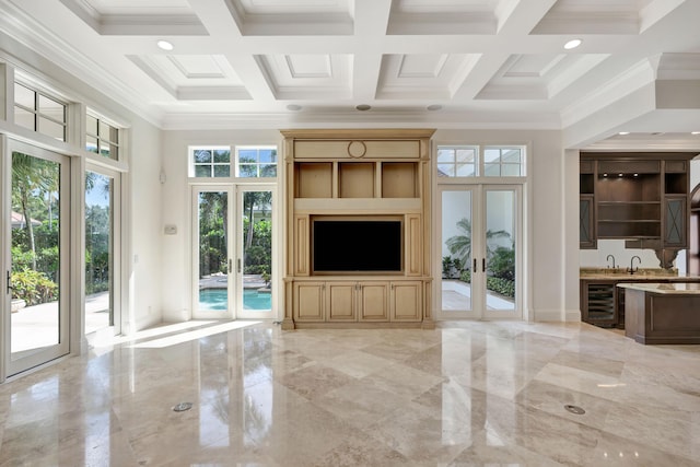 unfurnished living room featuring coffered ceiling, french doors, marble finish floor, and beverage cooler