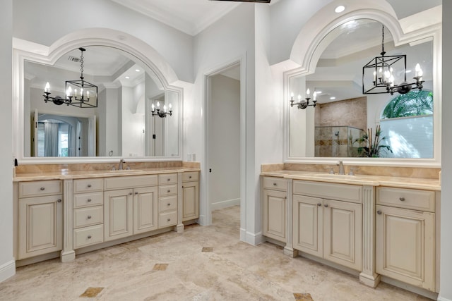 bathroom featuring vanity, a shower with shower door, ornamental molding, and tile patterned floors