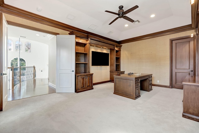 carpeted home office with a tray ceiling, ceiling fan, and crown molding