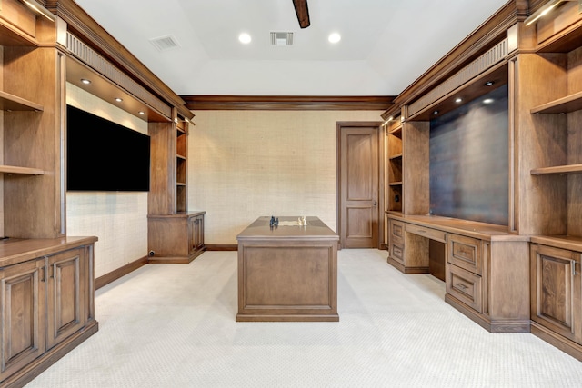 unfurnished office featuring a ceiling fan, built in study area, visible vents, and light colored carpet