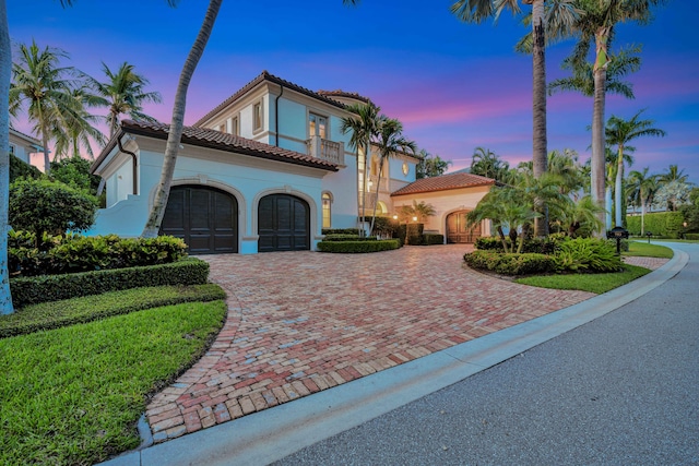 mediterranean / spanish house featuring a garage