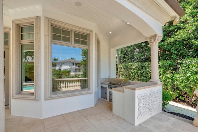 view of patio / terrace featuring a grill and exterior kitchen