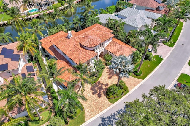 birds eye view of property with a water view and a residential view