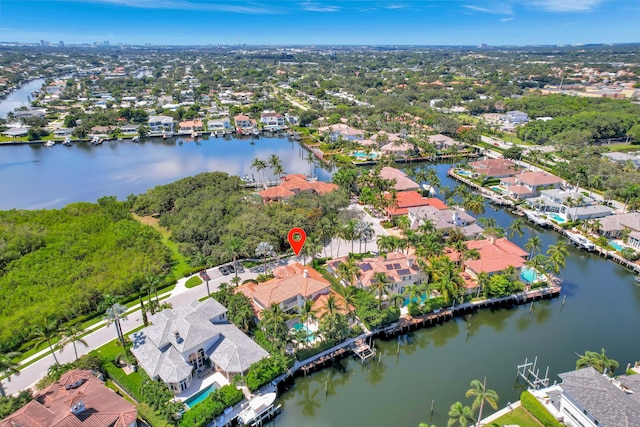 drone / aerial view with a water view and a residential view