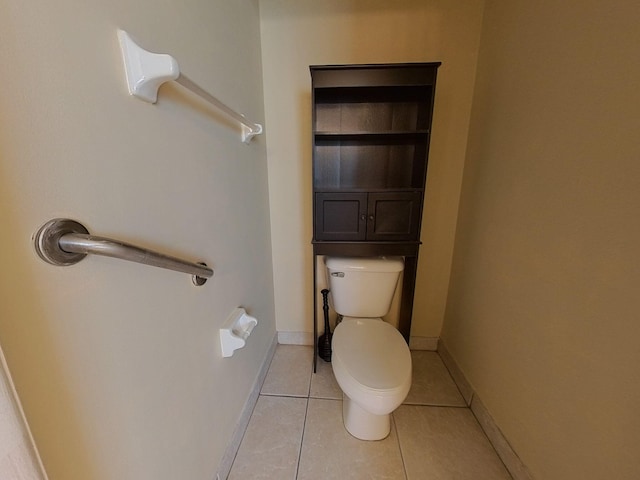 bathroom with tile patterned floors and toilet