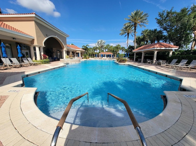 view of pool featuring a patio and a gazebo