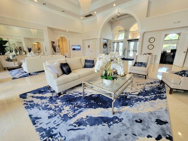 living room featuring ornamental molding, a high ceiling, and light tile patterned floors