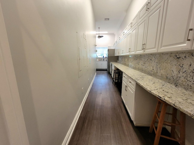 hallway featuring dark wood-type flooring