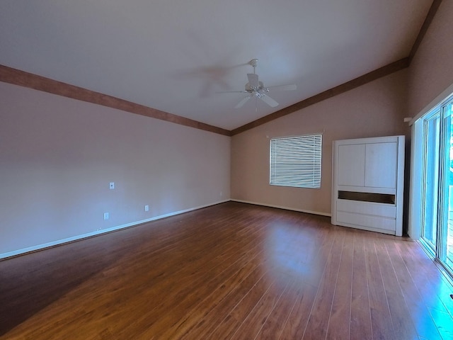 interior space featuring ceiling fan, a healthy amount of sunlight, wood-type flooring, vaulted ceiling, and crown molding