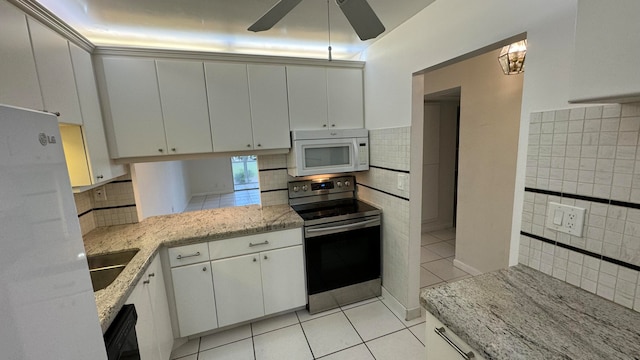 kitchen featuring ceiling fan, stainless steel electric stove, and white cabinets