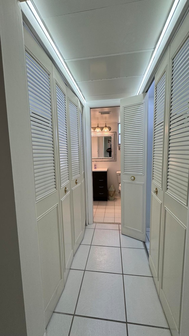 hallway featuring light tile patterned floors