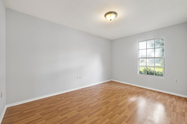 spare room featuring light hardwood / wood-style floors