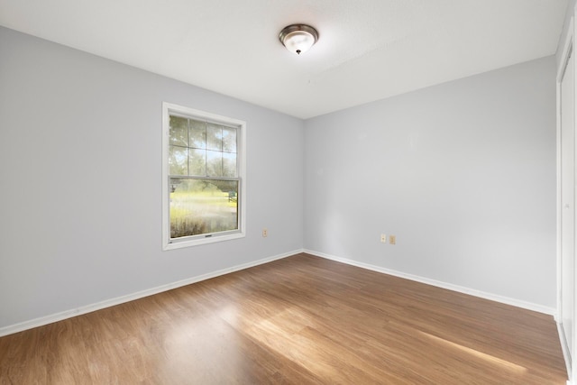 spare room featuring hardwood / wood-style floors