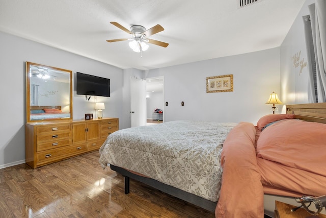 bedroom with hardwood / wood-style floors and ceiling fan