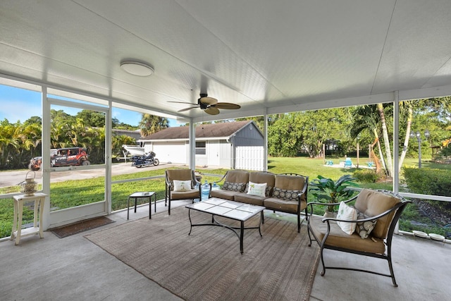 sunroom / solarium featuring ceiling fan