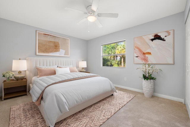 carpeted bedroom with ceiling fan