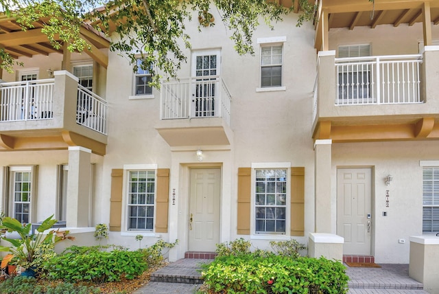 multi unit property featuring a balcony