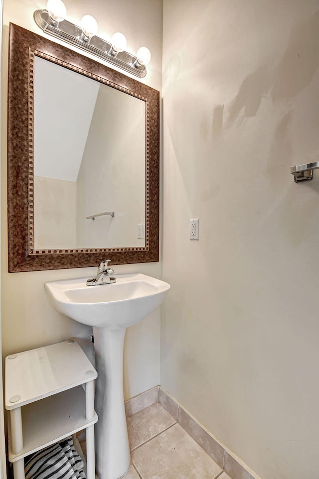 bathroom with tile patterned flooring and lofted ceiling