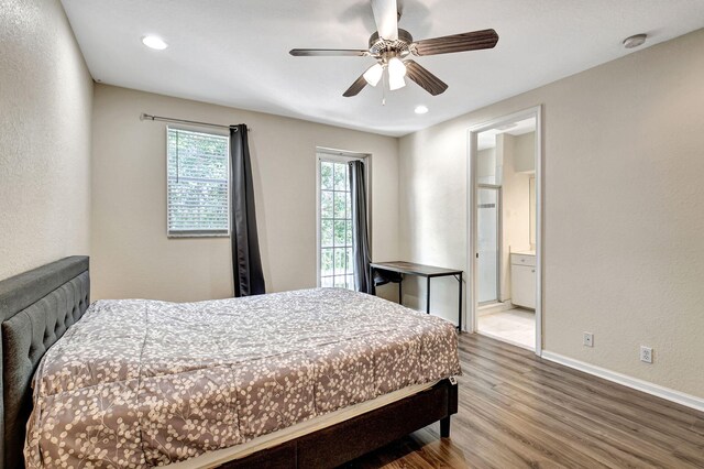 bedroom featuring ceiling fan, ensuite bathroom, and wood-type flooring