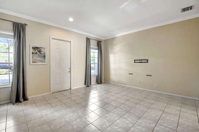 unfurnished bedroom with ornamental molding and light tile patterned floors