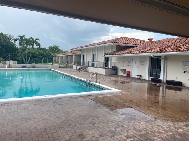 view of pool featuring a patio