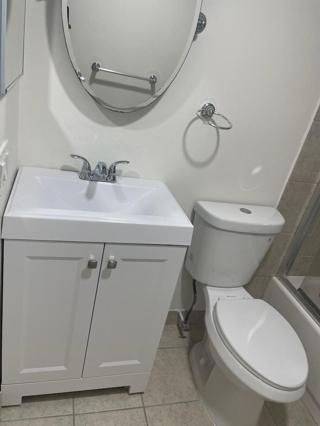 full bathroom featuring tile patterned floors,  shower combination, vanity, and toilet