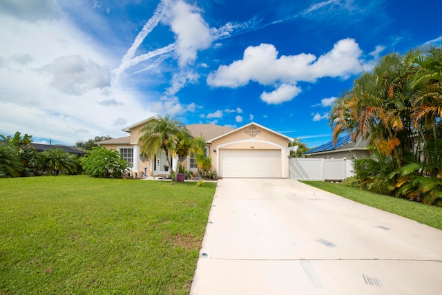 ranch-style home featuring a garage and a front yard