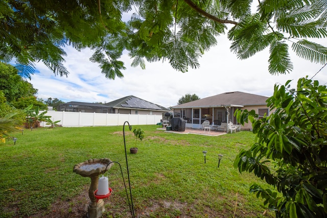 view of yard with a sunroom