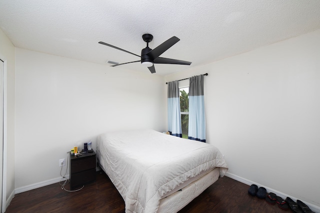 bedroom featuring a textured ceiling, ceiling fan, and hardwood / wood-style floors