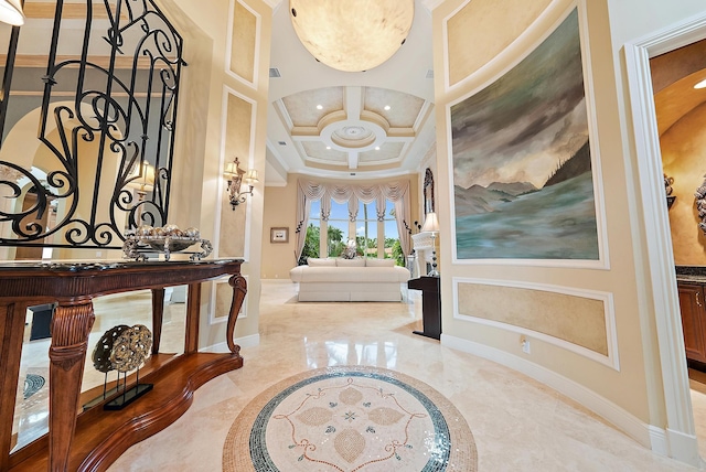 tiled entrance foyer featuring coffered ceiling, crown molding, and beam ceiling