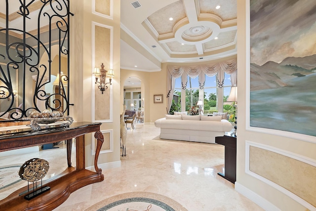 foyer with tile patterned floors, ornamental molding, beamed ceiling, and coffered ceiling