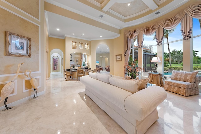 living room with light tile patterned flooring, a towering ceiling, coffered ceiling, and ornamental molding