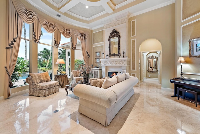 sitting room with ornamental molding, a towering ceiling, and coffered ceiling