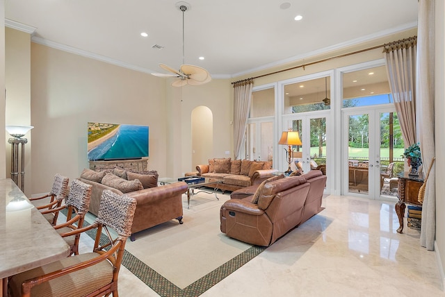 living room with ceiling fan, french doors, crown molding, and light tile patterned floors