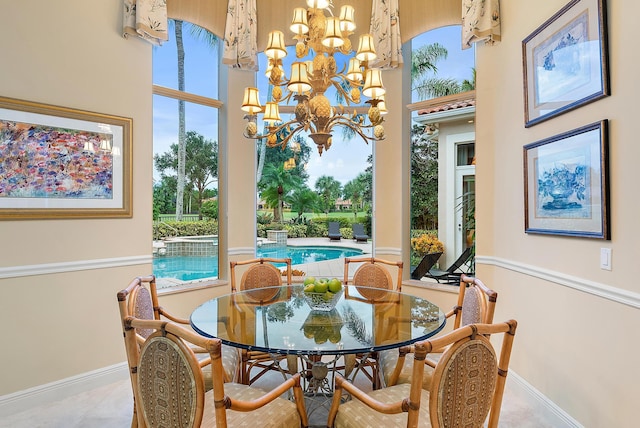 tiled dining area with an inviting chandelier